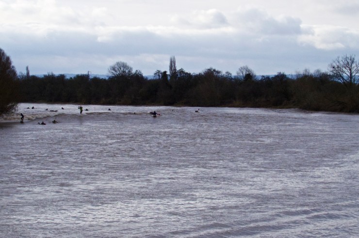 The Severn Bore approaching around the bend in the river