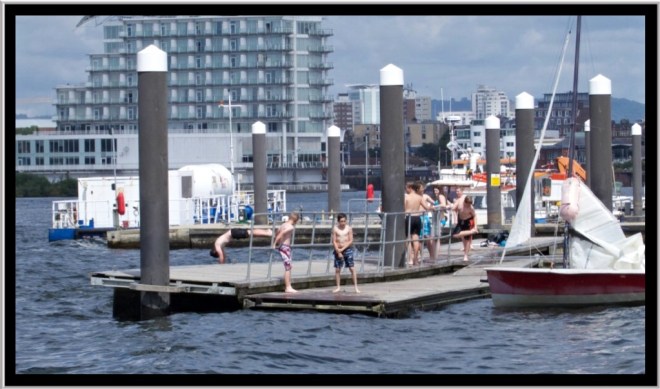The kids were having a great time jumping off the pontoons. 