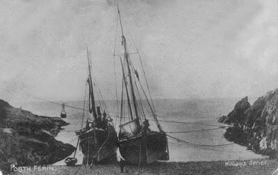 A old photo of Poth Ferin showing boats pulled up onto the beach.