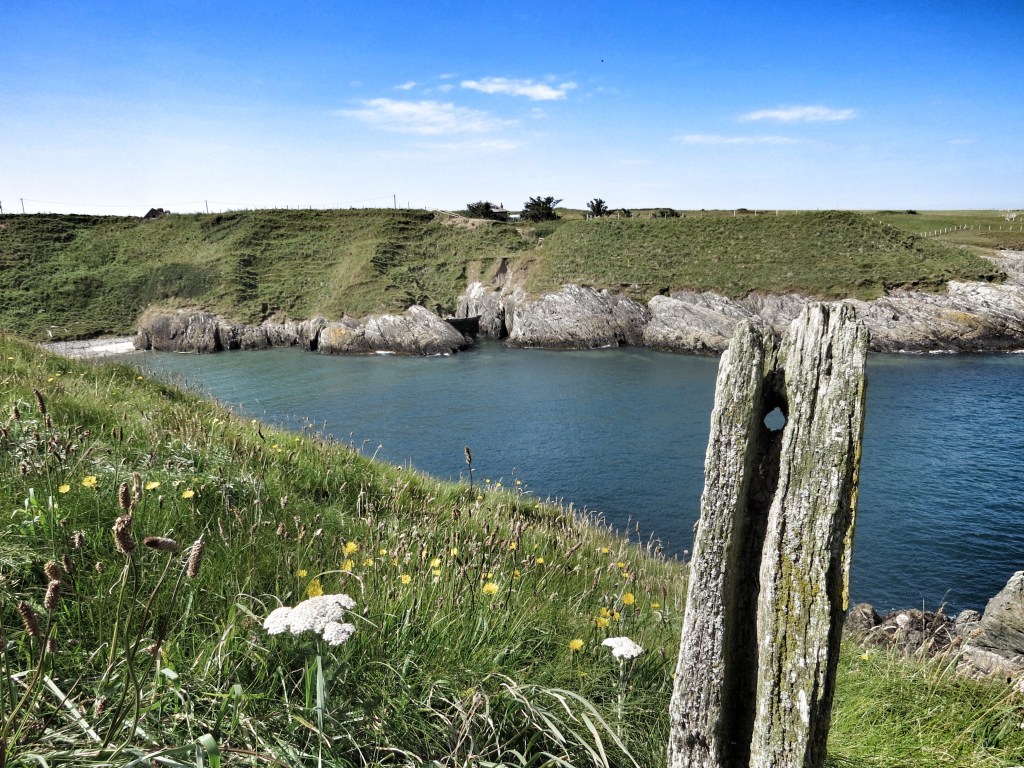 Looking back towards the larger part of Porth Ferin as we walked around the next headland.