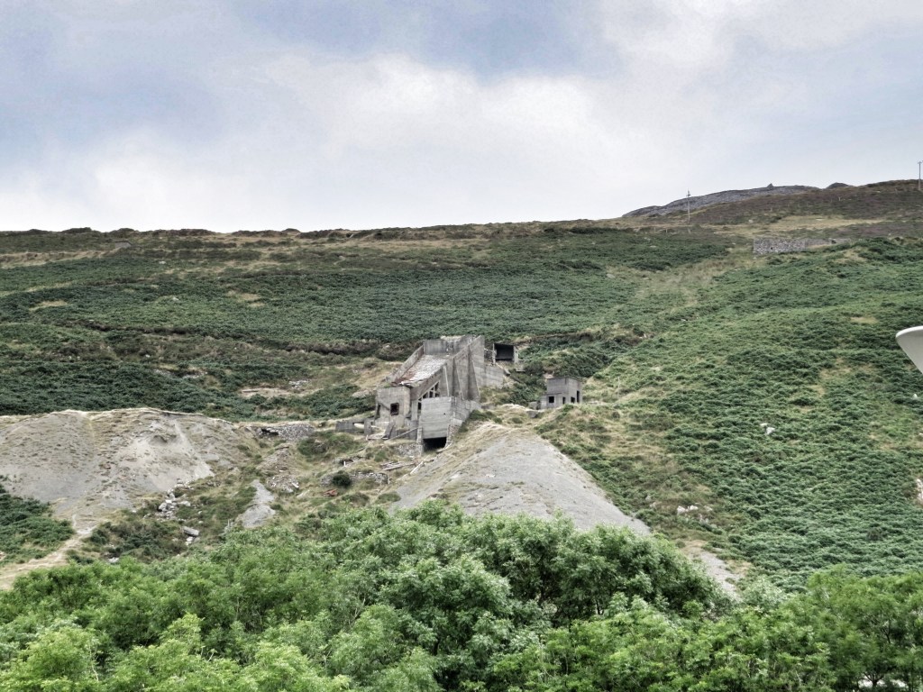 The old quarry workings are still visible on the steep slopes of the valley walls.