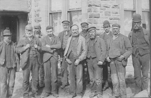A group of 19th C coal miners from the surrounding valley. A tough looking lot doing a tough and dangerous job.