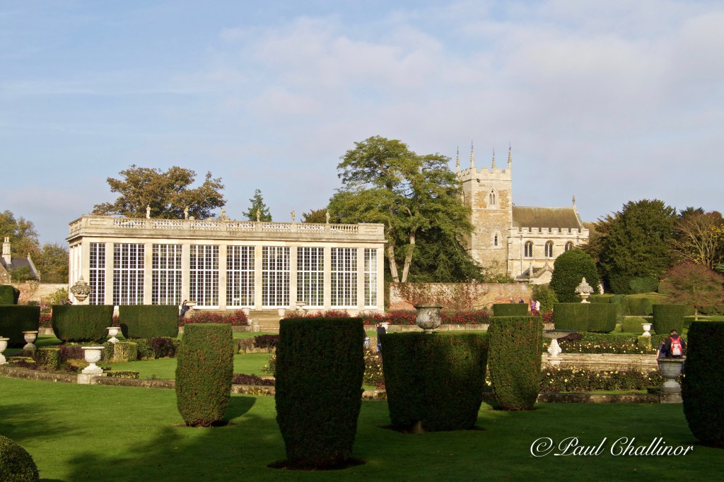 The Italianate Garden with the Orangery and church in the background.