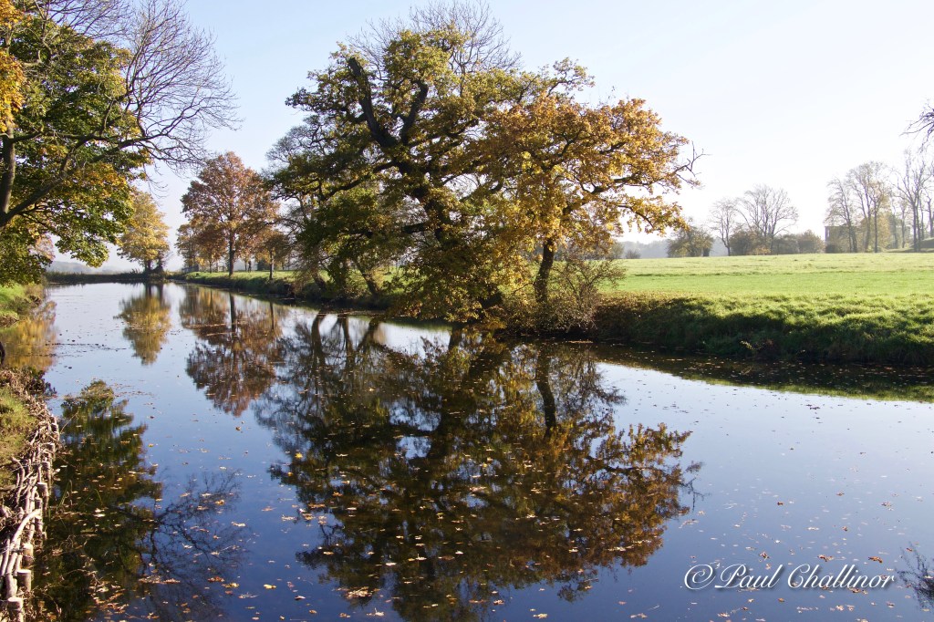 Autumn colours reflected in the moat.