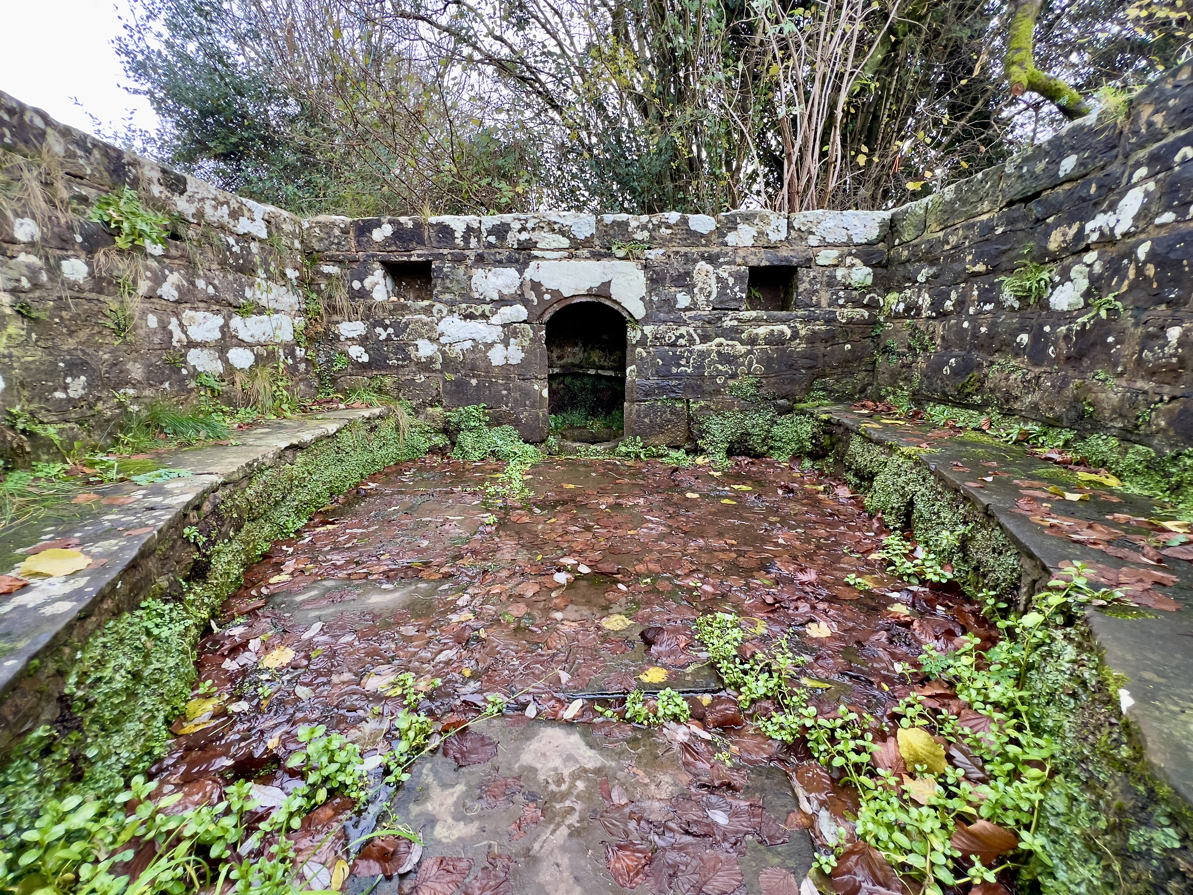 Inside the enclosure stone seating allows visitors to sit and reflect on their visit. 