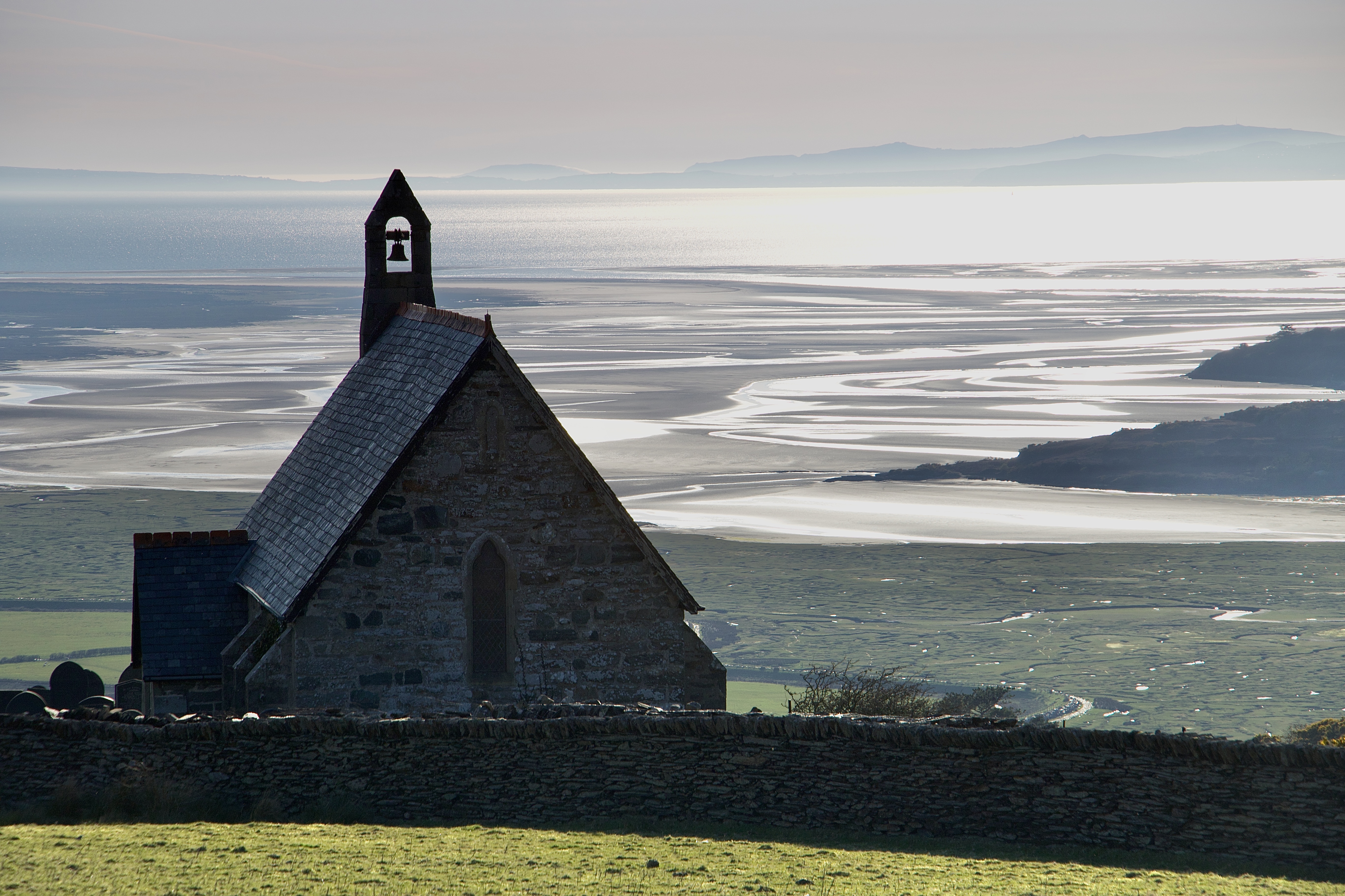 Llandecwyn overlooking the sea in isolation at the top of the hill - https://paulchallinor.com/2015/04/15/llandecwyn-an-ancient-church-in-merionydd/