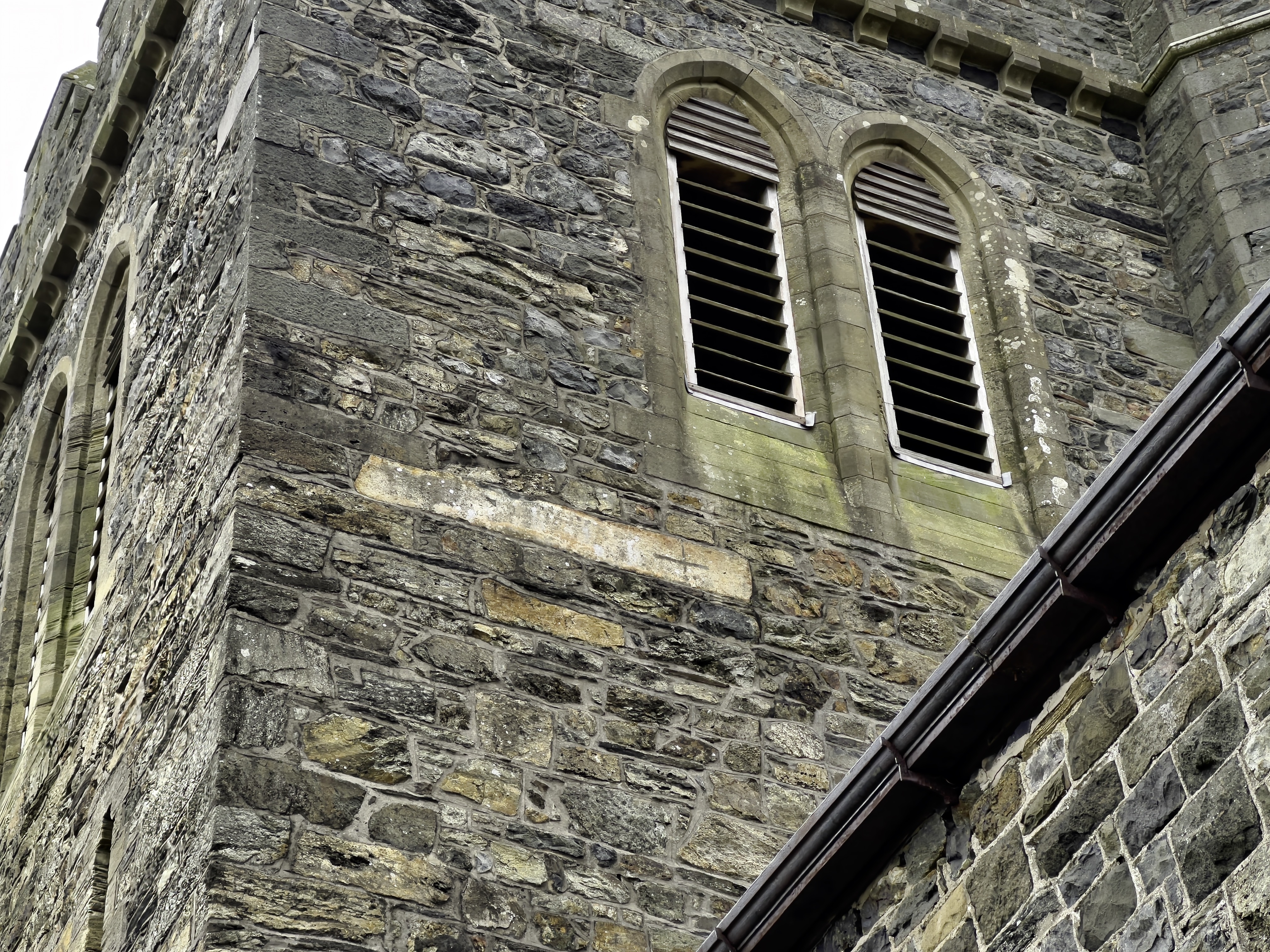 The stone from Bryn y Paderau is now incorporated into the tower of St Cadfan’s Church.